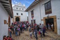 People in front of church in Villa de Leyva Colombia