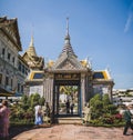people in front of an elaborate, silver building at the grand palace