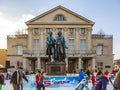 People in front of Goethe and SChiller monument enjoy ice skating Royalty Free Stock Photo