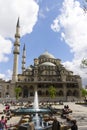 People in front of the New Valide Sultan Mosque on a sunny day