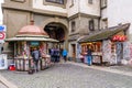 People in front of newspaper and souvenir kiosk in the old city center of Bern, Switzerland Royalty Free Stock Photo