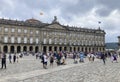 People in front of Pazo de Raxoi, a neoclassical palace on the Praza do Obradoiro Square. Santiago de Compostela, Galicia, Spain.