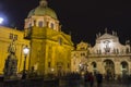 People in front of the St. Salvator Church and St. Francis of Assisi Church, Prague