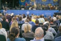 People in front of the stage. people at the concert. Blurry