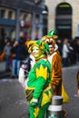 People in fun costumes celebrating at the carnival Fasching on Rose Monday parade in the city