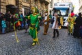 People in fun costumes celebrating at the carnival Fasching on Rose Monday parade in the city