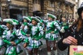 People in fun costumes celebrating at the carnival Fasching on Rose Monday parade in the city