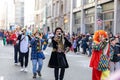 People in fun costumes celebrating at the carnival Fasching on Rose Monday parade in the city