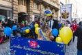 People in fun costumes celebrating at the carnival Fasching on Rose Monday parade in the city