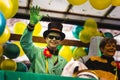 People in fun costumes celebrating at the carnival Fasching on Rose Monday parade in the city