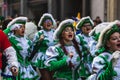 People in fun costumes celebrating at the carnival Fasching on Rose Monday parade in the city