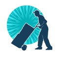 Silhouette of a male worker pushing lori wheels transporting carboard boxes.