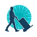 Silhouette of a male worker pushing lori wheels transporting carboard boxes. Royalty Free Stock Photo