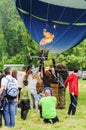 People gathered around a hot air balloon