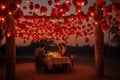 People gathered around a table beneath vibrant red lanterns, A romantic evening dinner underneath a canopy of heart balloons, AI