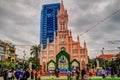 People gathered in the plaza out front of the Pink Cathedral in Da Nang Vietnam Royalty Free Stock Photo