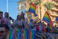 People gathering with rainbow flags in gay pride day in Torremolin
