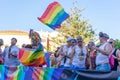 People gathering with rainbow flags in gay pride day in Torremolin