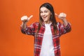 People, gesture, style and fashion concept - happy young woman or teen girl in casual clothes showing thumbs up, isolated over Royalty Free Stock Photo