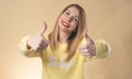 people, gesture, style and fashion concept - happy young woman or teen girl in casual clothes showing thumbs up