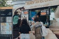 People getting ice-cream from Mr. Whippy van by Tower Bridge, London, UK