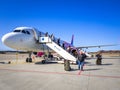 People getting off Wizz air plane