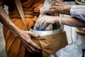 People give alms food and item offering to Buddhist monk Royalty Free Stock Photo