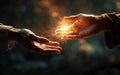 people give each other a helping hand, magic light between hands. Royalty Free Stock Photo