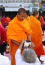 People give food offerings to 12,357 Buddhist monks Royalty Free Stock Photo