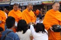 People give food offerings to 12,357 Buddhist monks Royalty Free Stock Photo