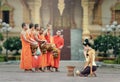 People give food offerings to Buddhist monks Royalty Free Stock Photo