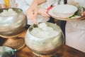 people give rice in alms bowl of buddhist monk, food offering for a monk Royalty Free Stock Photo