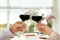 People with glasses of wine on blurred background Royalty Free Stock Photo