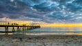 People on Glenelg Beach jetty