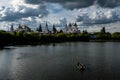 People go boating on a silver-grape pond near the Kremlin Izmaylovo