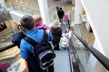 People go down the escalator in the mall Royalty Free Stock Photo