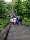 people go down stairs of borobudur temple