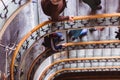 People go down and up the stairs old spiral staircase, spiral stairway inside an old house in Budapest, Hungary