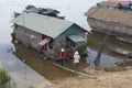 People go to the floating house at Tonle Sap lake, Cambodia. Royalty Free Stock Photo