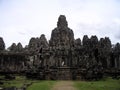 People going down stairs in ancient city Angkor Thom, Cambodia. Royalty Free Stock Photo