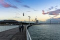 People going for an evening walk at the World Expo grounds in Lisbon at sunset