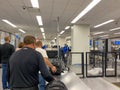 People going through Orlando International Airport MCO TSA security on a busy day