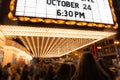 People going to cinema theater at the evening time. Royalty Free Stock Photo