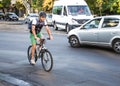 People going to work by bike. Street, road, cars