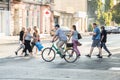 People going to work by bike. Street, road, cars