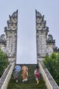 People are going up through the gate of Lempuyang temple on Bali isalnd Royalty Free Stock Photo