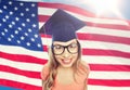 Smiling young student woman in mortarboard Royalty Free Stock Photo