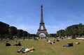 People on the grass at the Eifel Tower in Paris, France