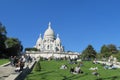 People on grass near Basilica of the Sacred Heart of Paris on Montmartre Royalty Free Stock Photo