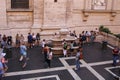 People at the great drinking fountain in the Vatican
